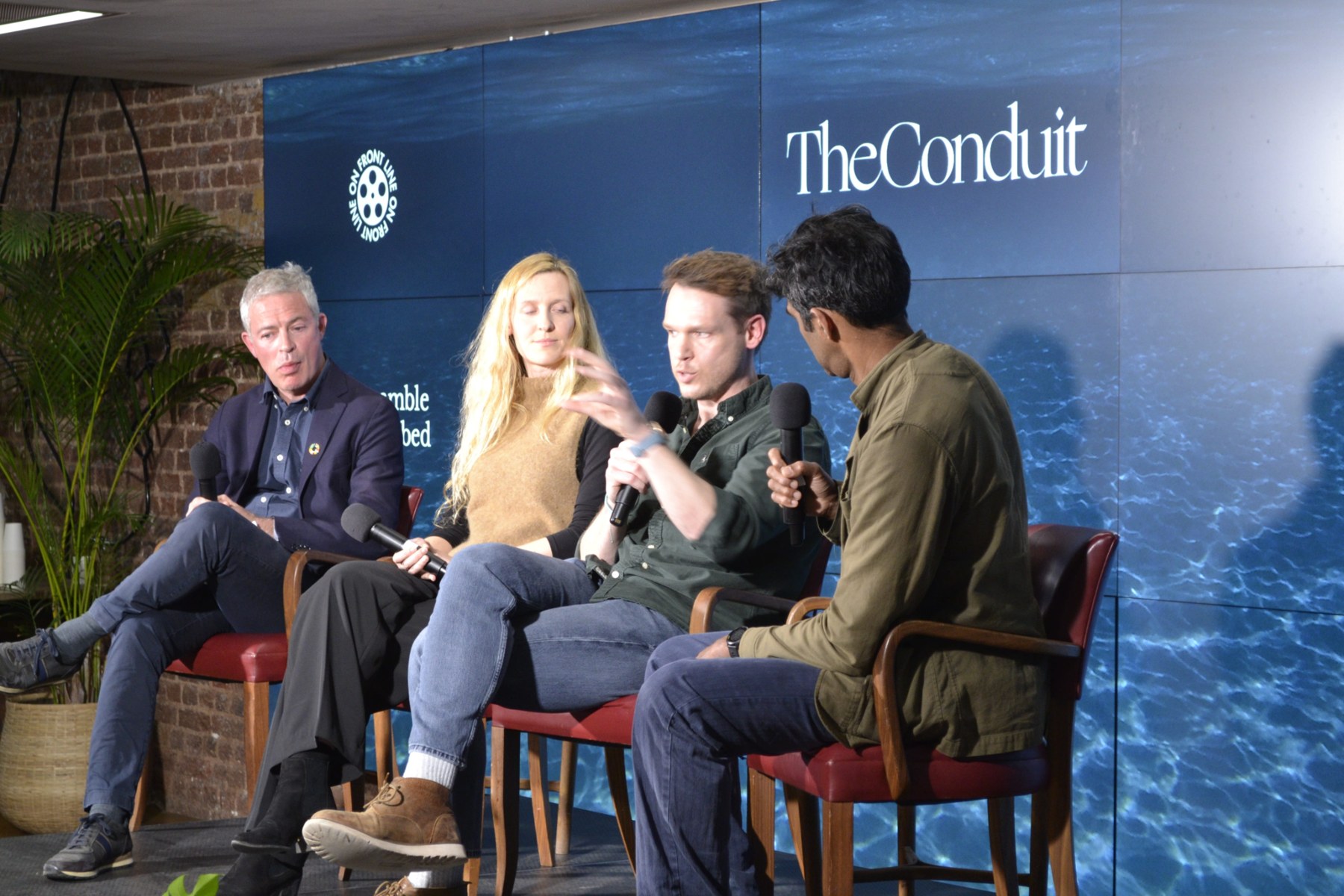 Luke McMillan speaking on a panel at The Conduit